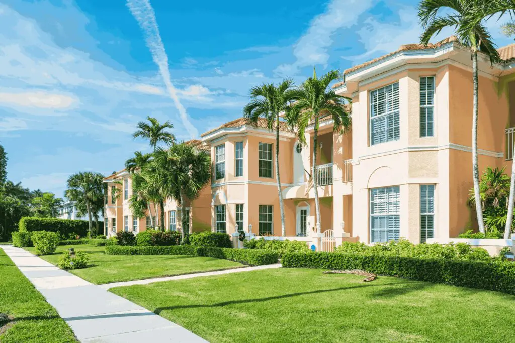 Pastel-colored townhouses with palm trees.
